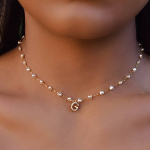 Initial necklace with synthetic pearls