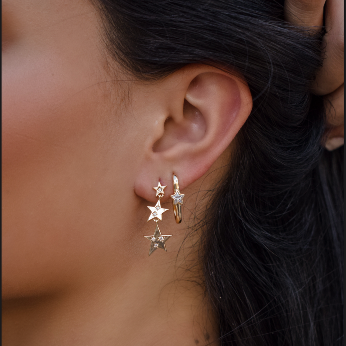 Hanging three-star earring