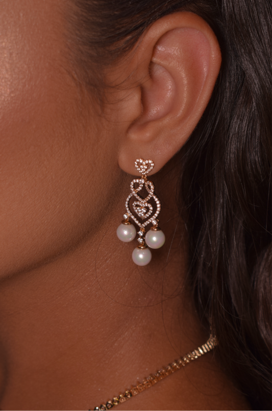 Pearl earring hanging with studded
