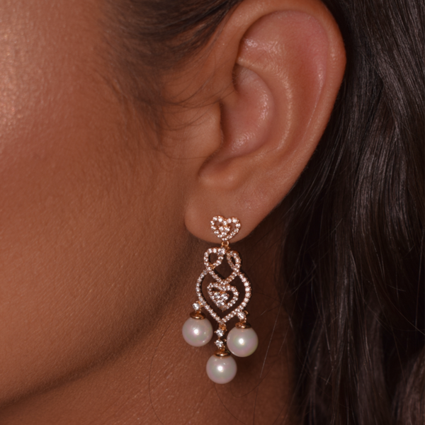 Pearl earring hanging with studded