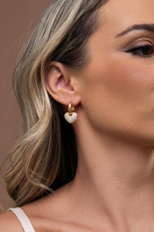 Earring with hanging studded heart